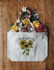 Be Nice Or Go Away Tote Bag with flowers in it 